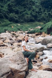 Woman standing on rock