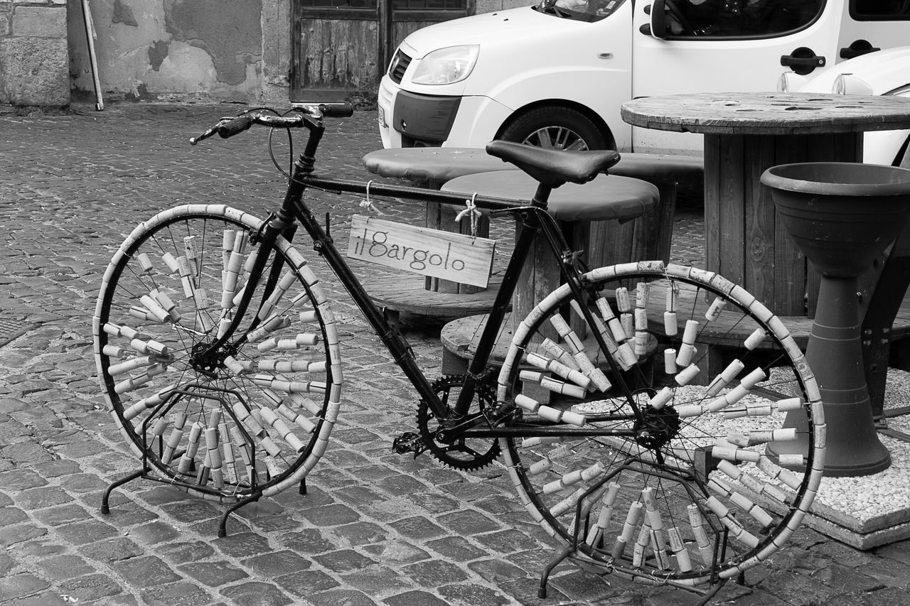 BICYCLES PARKED ON FOOTPATH