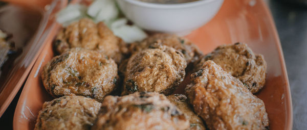 Close-up of fried food served in plate on table