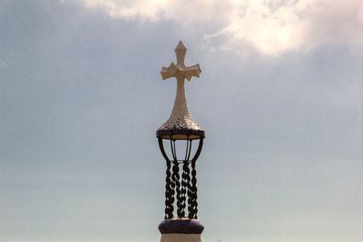 Low angle view of illuminated sculpture against sky