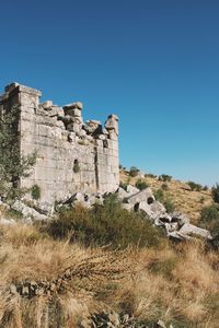 Old ruin building against blue sky