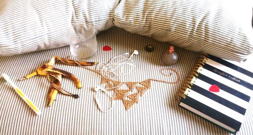 High angle view of various objects on bed