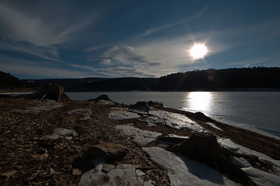 Scenic view of lake against sky during sunset