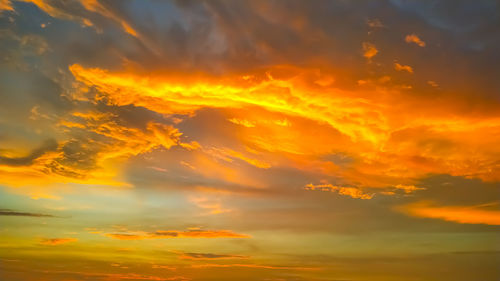 Low angle view of dramatic sky during sunset