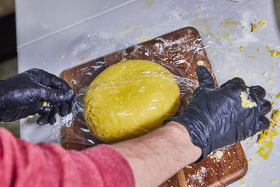 Cropped hand of person holding food