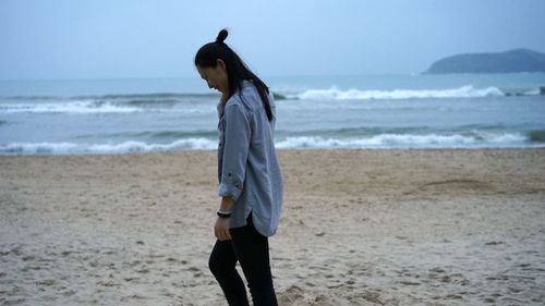 Woman walking on beach