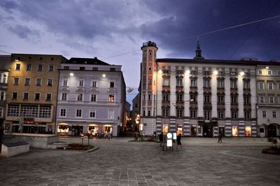 Buildings in city at dusk