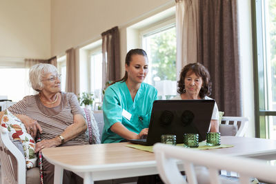 People sitting on table at home