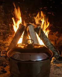 Close-up of fire burning at night