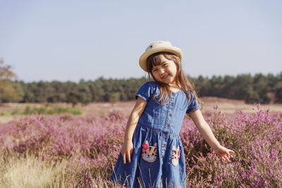 Girl standing on field