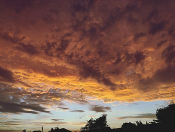 Low angle view of dramatic sky during sunset