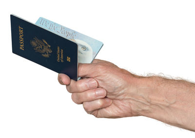 Close-up of hand holding hands over white background