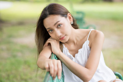 Portrait of a beautiful young woman in field