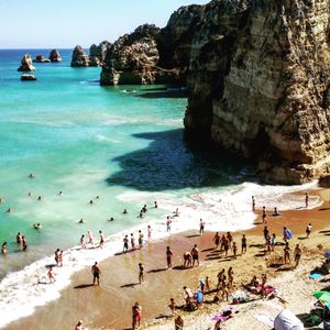 High angle view of people enjoying at beach