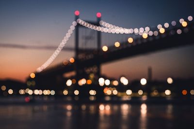 Blurred illuminated bridge over the river