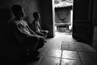 People sitting outside building