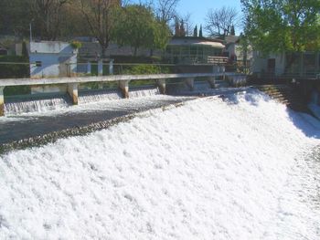 Scenic view of water fountain against sky