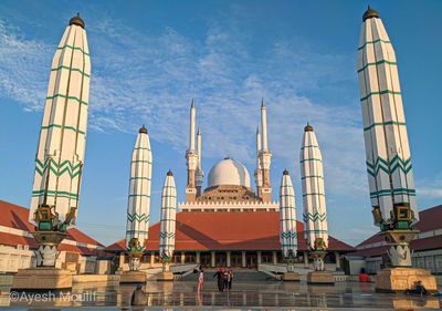 Low angle view of temple building against blue sky