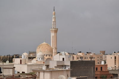 Buildings in city against sky