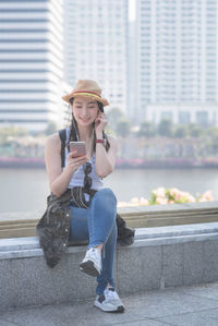 Portrait of young woman using mobile phone