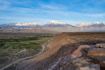 Owens river valley cliff view distant snowy peaks of eastern sierra nevada mountains california usa