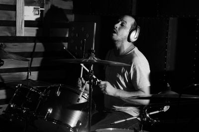 Portrait of drummer playing drums