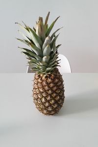Close-up of fruit on table against white background