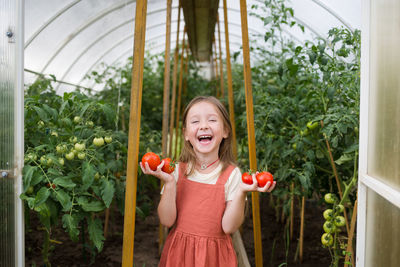 Portrait of a smiling girl holding food