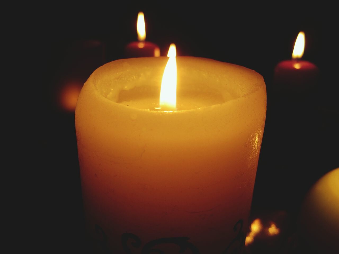 flame, burning, candle, fire - natural phenomenon, illuminated, heat - temperature, indoors, glowing, lit, candlelight, close-up, tea light, fire, night, dark, darkroom, still life, focus on foreground, black background, lighting equipment