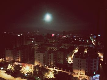 Illuminated cityscape at night