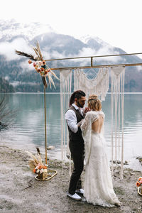 Young couple standing in water