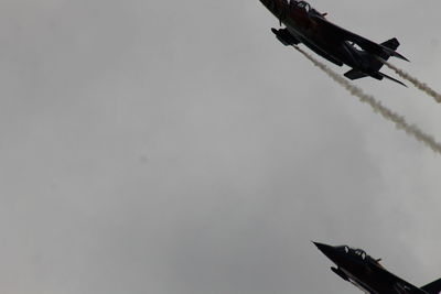 Low angle view of airplane flying in sky
