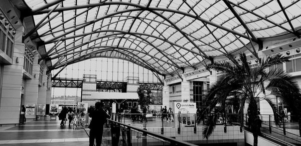 People walking on railroad station platform