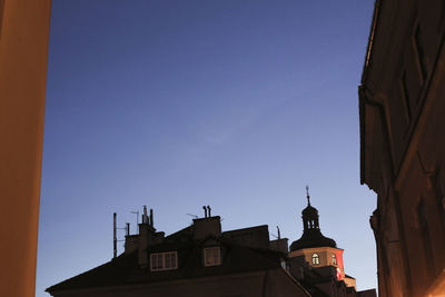 Low angle view of statue against blue sky