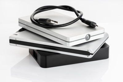 Close-up of open book on table against white background