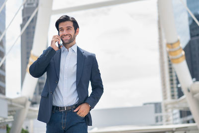 Portrait of young man using mobile phone