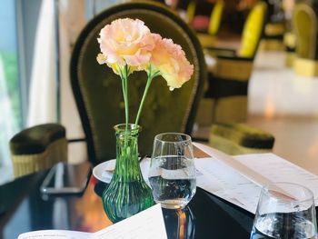 Close-up of flower vase on table in restaurant