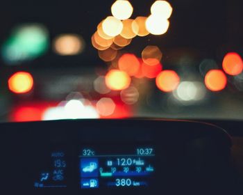 Close-up of illuminated lighting equipment at night
