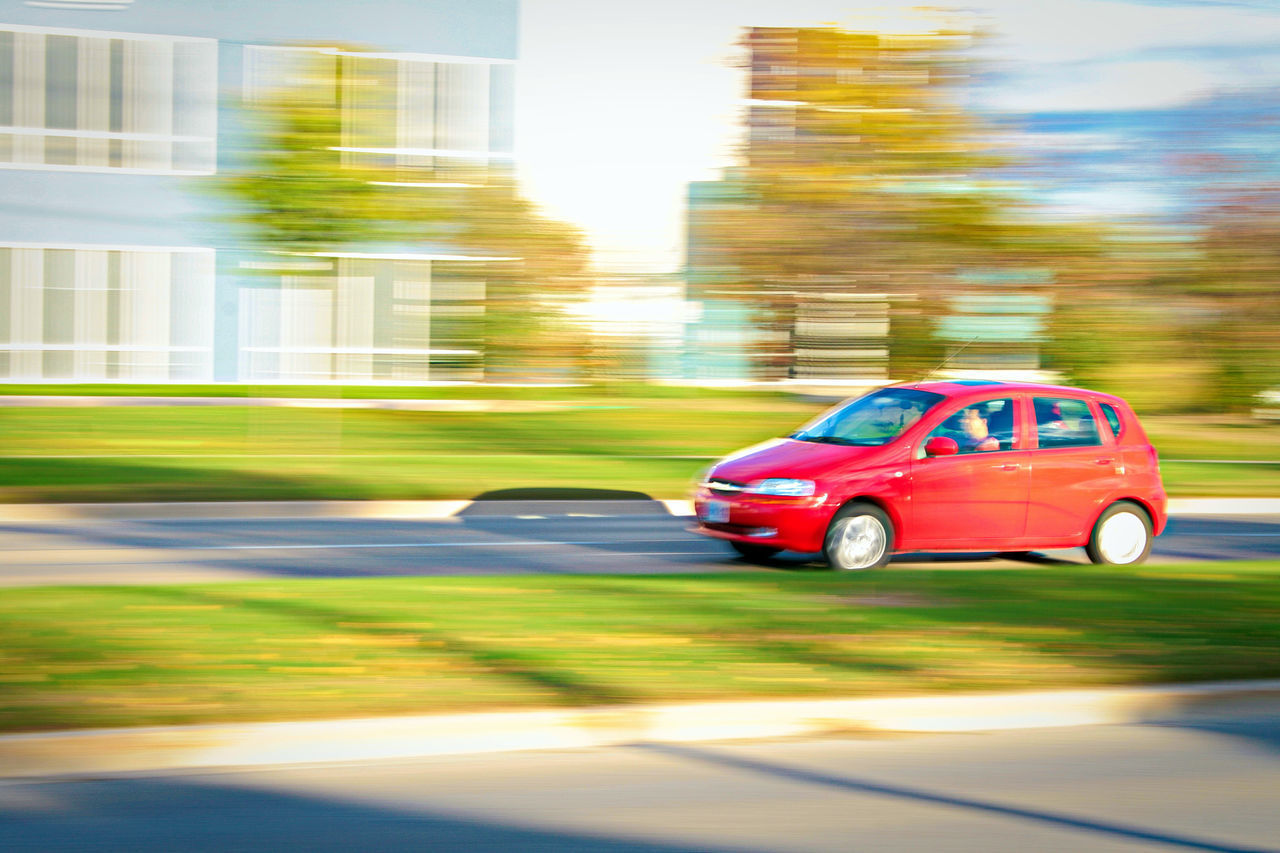 CAR MOVING ON ROAD IN CITY