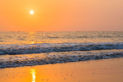 Scenic view of sea against clear sky during sunset