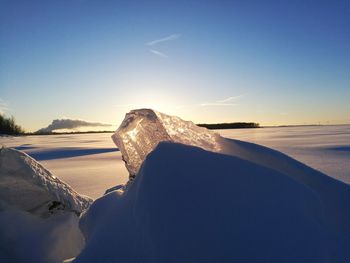 Scenic view of sea against clear sky during winter