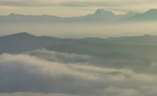 Scenic view of mountains against sky during sunset