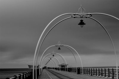 Bridge over sea against sky