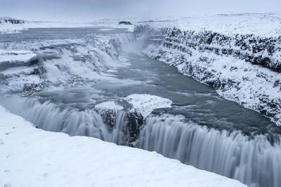 Scenic view of frozen waterfall