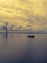 Scenic view of sea against sky at sunset