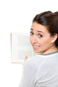 Portrait of smiling young woman against white background