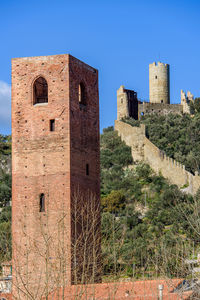 Old ruins of building against clear blue sky