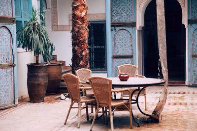 Wicker chairs and table in front of building