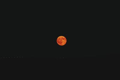 Scenic view of moon against clear sky at night