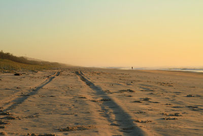 Scenic view of beach against clear sky